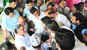 He listens to the grievances of the disaster-affected persons.