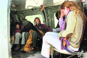 Foreigners being evacuated in an IAF helicopter from Harsil in Uttarkashi despite bad weather.