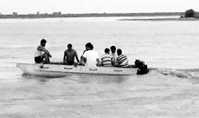 Divers make an attempt to fish out the bodies of the youths drowned in the Yamuna near the Mimarpur Ghat in Sonepat.