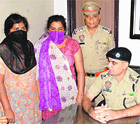 Dolly and her daughter Preeti in police custody in Jalandhar on Saturday