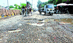 The potholed Guru Nanak Pura-Ladowali Road strech causes inconvenience to commuters in Jalandhar