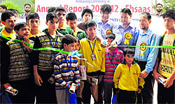 Prof Talat Ahmad, Vice-Chancellor, Kashmir University, with a group of children at the release of JKYFs annual report 2011-12 in Srinagar on Saturday