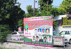 An illegal hoarding put up along a road near Udham Singh Nagar area in Ludhiana on Saturday. photo: Inderjeet Verma