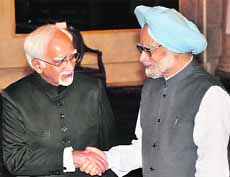 Vice President Hamid Ansari meets PM Manmohan Singh after being sworn in on Saturday.