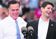 Republican presidential candidate Mitt Romney with Paul Ryan after announcing him as his running mate aboard USS Wisconsin on Saturday.  AFP