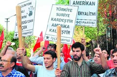 Members of the Left wing Turkish group march to the US embassy to protest against the visit of US Secretary of State Hillary Clinton in Ankara on Saturday.  AFP