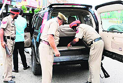 Police officials check a vehicle during a drive ahead of the Independence Day in Amritsar on Sunday