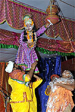 Artistes from Vrindavan perform "Makhan chori" during the Janmashtami celebrations at Shree Ram Mandir in the Ganpati Township on Saturday evening