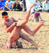 Players in action during a wrestling competition at Dadu Majra in Chandigarh on Sunday.