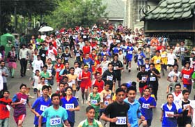 Participants in a half-marathon race on the occasion of International Youth Day on the Ridge in Shimla on Sunday