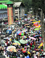 People gather in the Lal Chowk area for shopping ahead of Eid-ul-Fitr in Srinagar on Sunday.