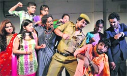 Artistes enact a scene from the play, Baba Ki Jai Ho, at Natrang Theatre in Jammu on Sunday. A Tribune photograph 