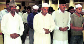 Devotees offer namaz during an iftar party at Badami Bagh in Srinagar.