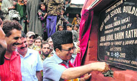 The Minister for Finance and Ladakh Affairs, Abdul Rahim Rather, lays the foundation stone of school building in Budgam.