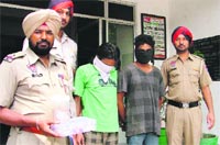The suspects in police custody in Ludhiana on Sunday. Photo: Inderjeet Verma