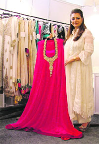 All dressed up: One of the stall owners with her larger than life creations