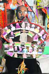  Kite maker Jagmohan Kanojia displays a kite with images of Indian Prime Ministers and Presidents, in Amritsar on Monday.