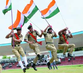 NCC cadets celebrate with the Tricolour in their hands after the full-dress rehearsal for the Independence Day function at the Multipurpose Sports Stadium on Monday. Punjab Education Minister Sikandar Singh Maluka will unfurl the National Flag in Bathinda on August 15.