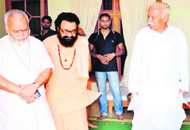 RSS national chief Mohan Bhagwat (right) with former Union Minister Swami Chinmayanand and Maha Nirvani Akhada chief Mahant Ravindra Puri at Bharat Mata Mandir in Haridwar on Monday. 