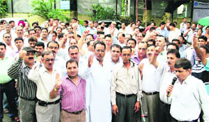 Bank employees holding a demonstration in support of their demands in Dehradun on Monday.