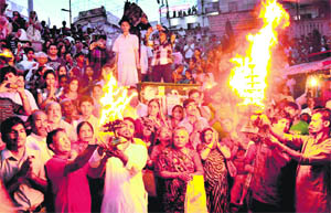 Devotees perform a Ganga aarti at Har-ki-Pauri in Haridwar on Monday. 