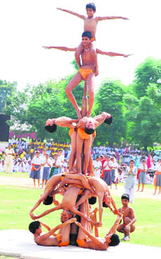 School students rehearse their presentation for the coming Independence Day celebrations in Kurukshetra on Monday. 