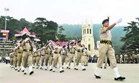 Police personnel march during a rehearsal for Independence Day parade in Shimla on Monday