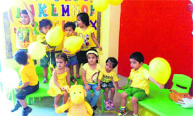 Students of the Cherubs pre-school celebrate Yellow Day in Ludhiana on Monday.