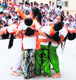 Students of Cambridge International School perform at a function to mark the Independence Day in Amritsar on Tuesday.