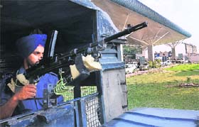 An armed commando keeps a vigil at the Chandigarh Airport following a warning issued by the Intelligence Bureau on Tuesday