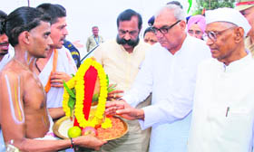 Governor Jagannath Pahadia and Chief Minister Bhupinder Singh Hooda lay the ceremonial coconut at the foundation stone-laying ceremony for a Tirupati Balaji temple in Kurukshetra on Tuesday.