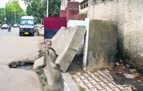 An open manhole in front of a lavatory poses threat to commuters in Srinagar