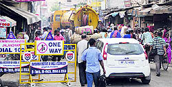 A Municipal Corporation vehicle (yellow colour) flouts a traffic rule by wrongly entering the road between the city railway station and Madan Flour Mill chowk, which has been declared as one way for ensuring smooth traffic, in Jalandhar on Tuesday