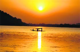 Tourists enjoy a shikara ride at the Dal Lake in Srinagar