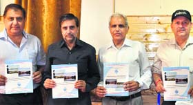 Forest Minister Mian Altaf Ahmad (2nd from left), along with SPCB officials, releases a study on Mansar and Surinsar lakes in Srinagar on Tuesday