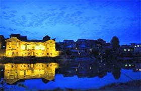 A magnificent view of the reflection of a heritage building in the Jhelum waters in Srinagar