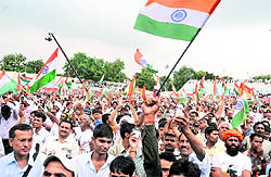 Yoga guru Ramdevs supporters at Ambedkar Stadium in New Delhi on Tuesday