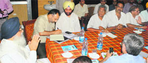 Punjab Chief Minister Parkash Singh Badal at a meeting with a delegation of the affected traders. 