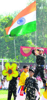 A child holding the Tricolour during I-Day celebrations at Government College, Phase VI, Mohali, on Wednesday. 