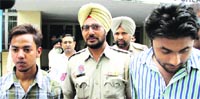 The accused youths, Deepak Saini and Lovepreet (right), after being produced before a court in Jalandhar on Thursday. Photo: Sarabjit Singh
