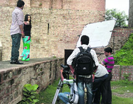 Mumbai-based actress Komal and Punjabi singer-turned-actor Sohan Shankar shoot for a song at the Bhimgarh Fort in Reasi on Thursday. A Tribune Photograph
