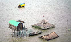 The sadhus huts, which were submerged as a result of the rise in water level of the Ganga and Yamuna, at Sangam in Allahabad on Thursday .  PTI