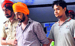 The accused, Maninder Singh and Tajinder Singh, in the District Courts at Mohali on Friday