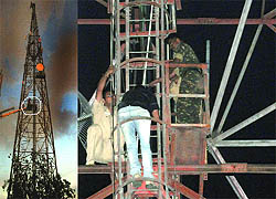 A rescue team tries to negotiate with the Army jawan who clambers up a tower near New Delhi Railway Station on Friday