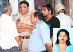 The police questions relatives of Shikha Dhawan (inset), after she was found hanging from a ceiling fan at her residence in Jalandhar. 