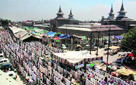 Kashmiri Muslims attend prayers during Jumat-ul-Vida or the last Friday of the month of Ramadan outside Jamia Masjid in Srinagar.