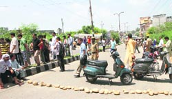 Family members of the victim block a road in Jammu on Friday. A Tribune photograph