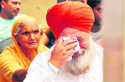 Sukhjinder Singhs father grieves in Ludhiana on Friday.