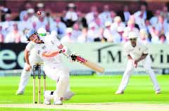 England skipper Andrew Strauss evades a bouncer at Lords on Friday.