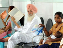 Patients in the OPD block use paper and handkerchiefs to fan themselves while waiting in the queue as power supply to the Civil Hospital was shut down for maintenance. The gensets deployed in the hospital proved to be woefully inadequate in handling the load.